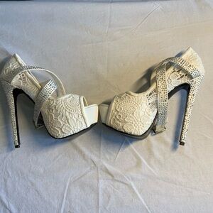 White Lace with Rhinestones heel. New without box and tags.